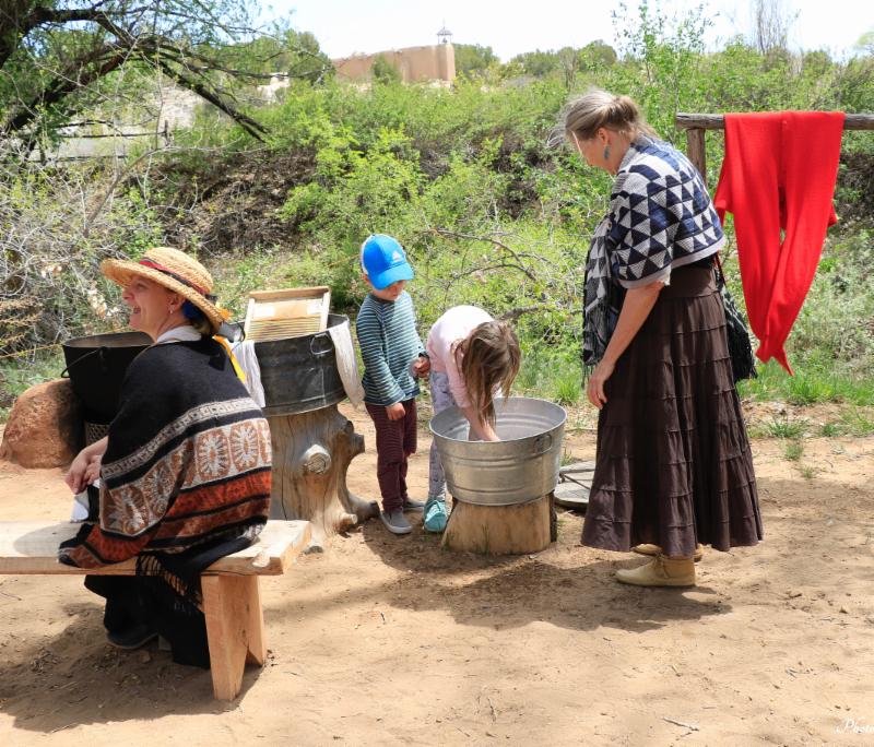 Washing clothes at El Rancho de las Golondrinas